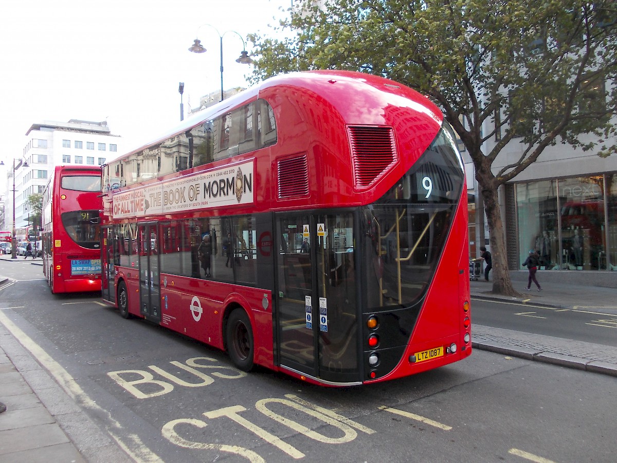 A new Routemaster bus in London showing the rear entrance.