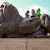 Kids ride one of the bronze lions at the base of Nelon's Column, Trafalgar Square, London (Photo by Lisa Norwood)