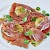 A salad of prosciutto, tomatoes, and toasted parmesean-crusted goat cheese, Le Pont de la Tour, London (Photo courtesy of the restaurant)