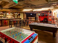 A games room at London's The Generator Hostel