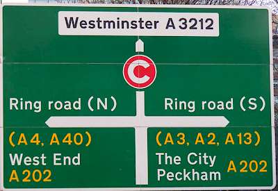 A sign at the Ring Road around London; your choices are left (north toward the West End), right (south toward The City) or straight ahead (into the Congestion Charge Zone and toward Westminster on local roads)