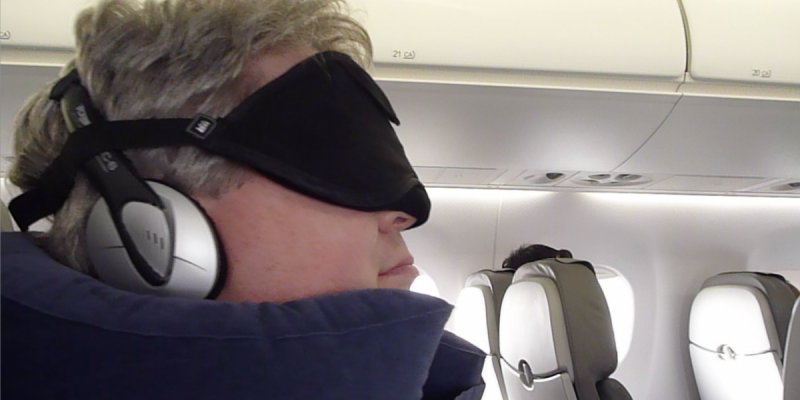 The author wearing his sleeping-on-the-plane gear (Photo Â© Reid Bramblett)