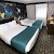 A bedroom with the sofabed in bed mode, Holiday Inn Salisbury-Stonehenge, Salisbury and Stonehenge (Photo courtesy of the property)