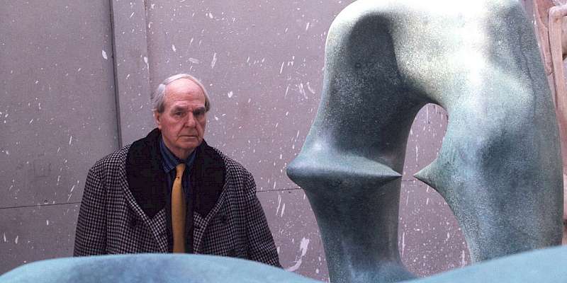 Henry Moore in 1975, standing next to his sculpture Working Model for Oval with Points (Photo by Allan Warren)